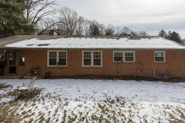 view of snow covered house