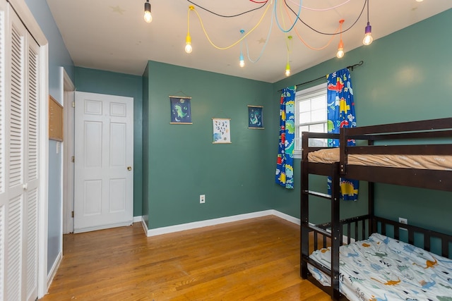 bedroom featuring hardwood / wood-style flooring and a closet