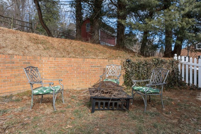 view of patio / terrace with an outdoor fire pit