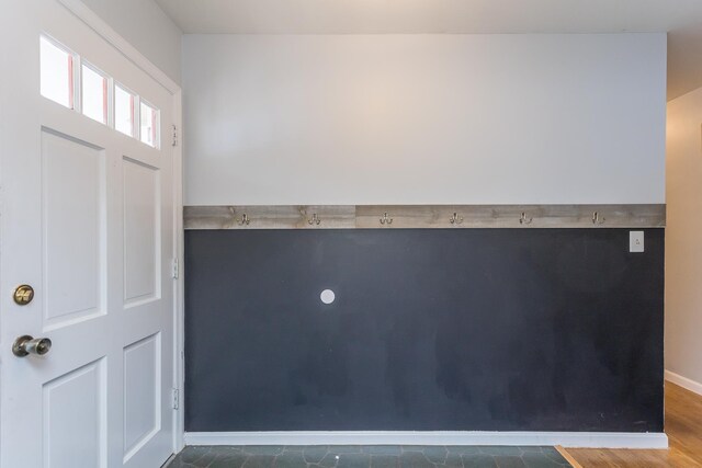 entryway with dark wood-type flooring