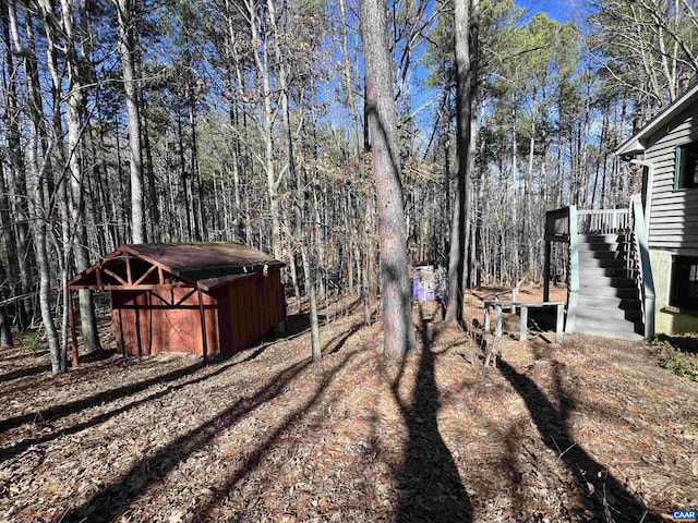 view of yard with stairs and a hot tub