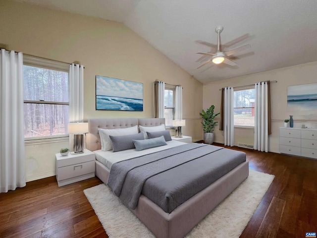 bedroom featuring ceiling fan, vaulted ceiling, and dark wood-style flooring