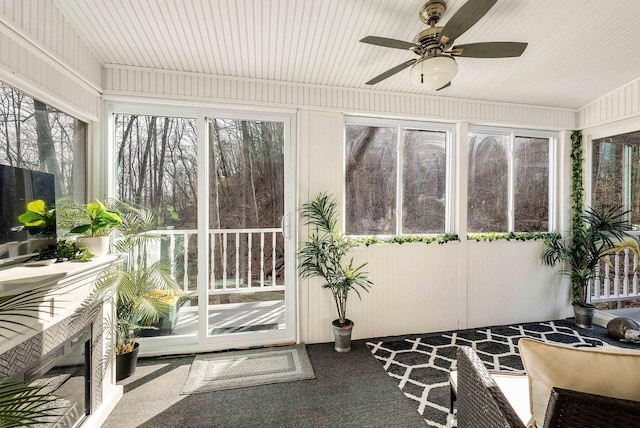 sunroom / solarium with ceiling fan