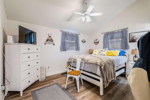 bedroom with lofted ceiling, hardwood / wood-style floors, and ceiling fan