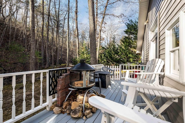 deck featuring an outdoor fire pit