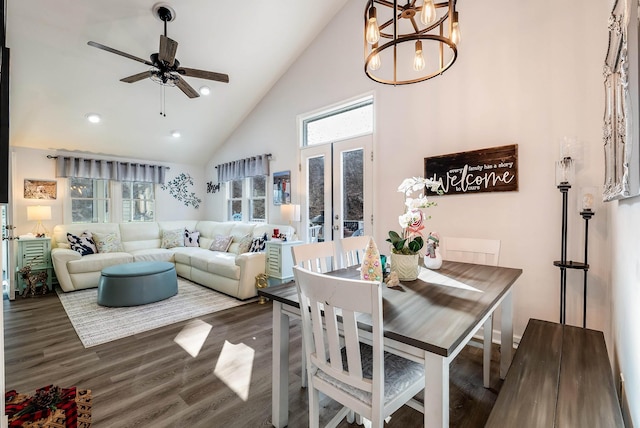 dining room with dark wood-type flooring, a healthy amount of sunlight, high vaulted ceiling, and french doors