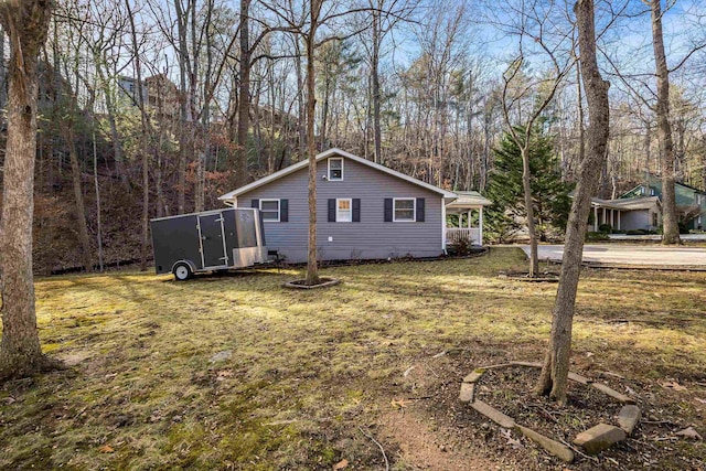 view of side of property featuring a yard