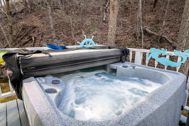 deck with a hot tub