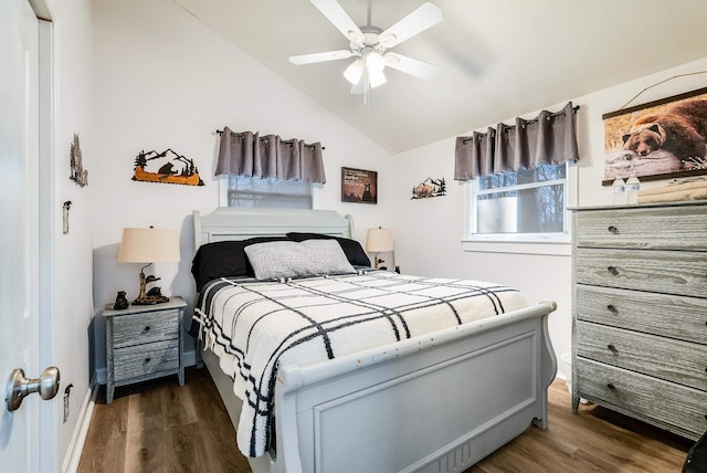 bedroom featuring lofted ceiling, dark hardwood / wood-style floors, and ceiling fan