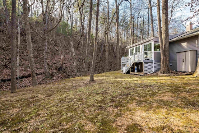 view of yard with a sunroom