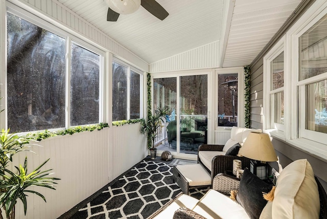 sunroom / solarium with lofted ceiling and ceiling fan