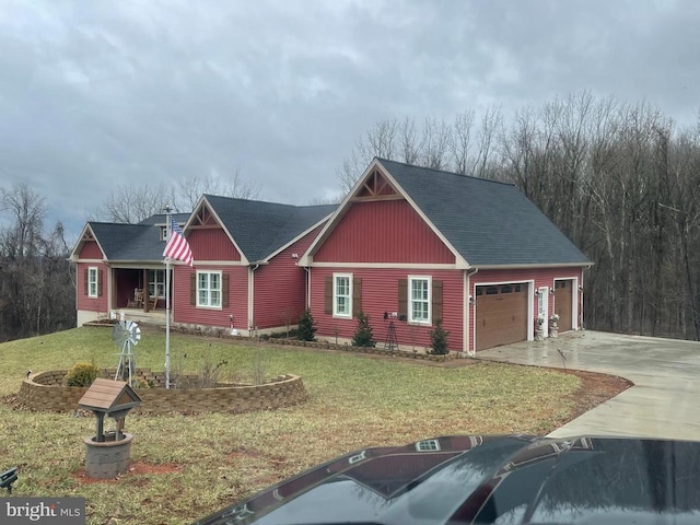 view of front of home with a garage, a front lawn, roof with shingles, and driveway