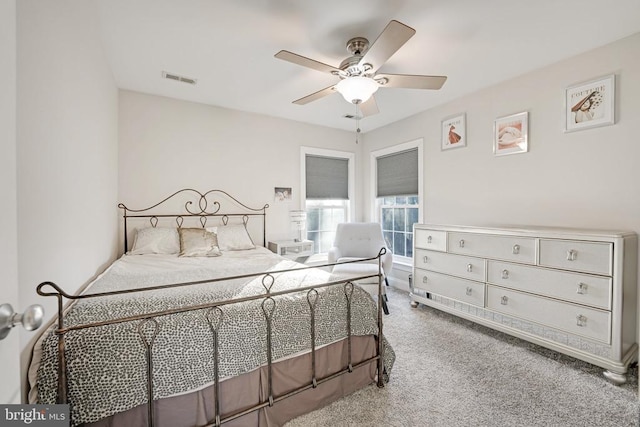 bedroom featuring a ceiling fan, carpet, and visible vents