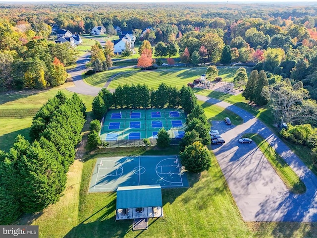 drone / aerial view featuring a forest view