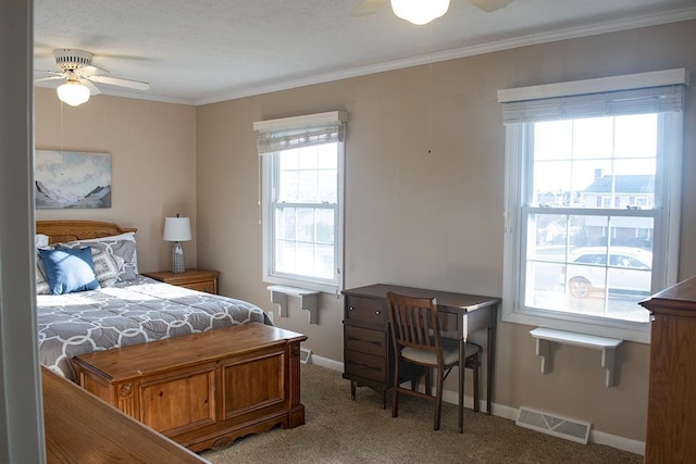 bedroom with crown molding, carpet floors, and ceiling fan