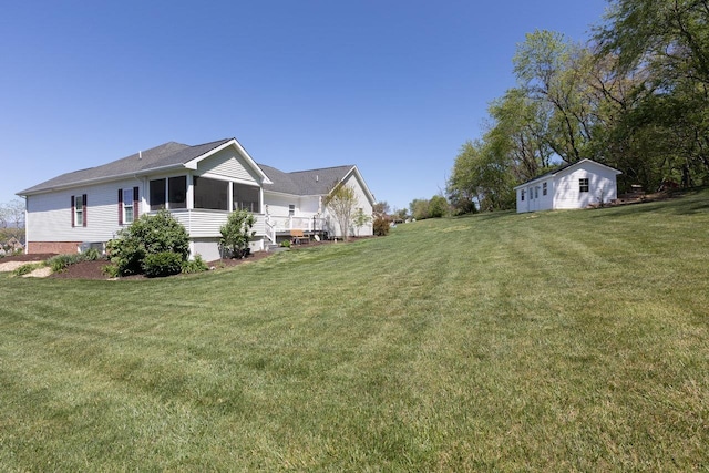 view of yard featuring a sunroom