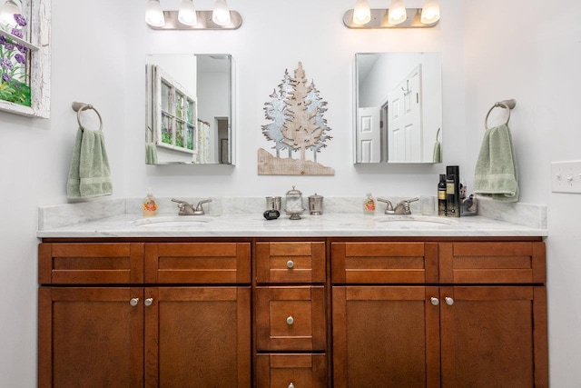 bathroom featuring a sink and double vanity