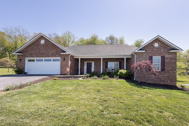 ranch-style house with an attached garage, a front lawn, driveway, and brick siding