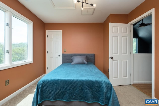 bedroom featuring baseboards and carpet flooring