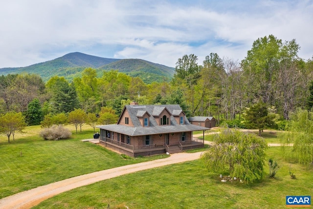 bird's eye view featuring a mountain view and a wooded view