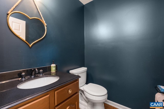 half bath with vanity and toilet