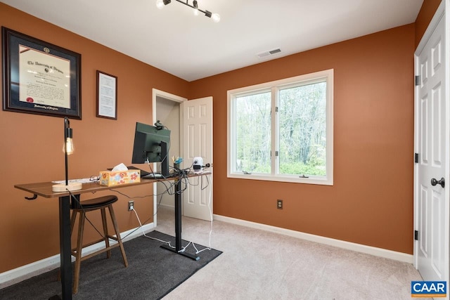 office with baseboards, carpet flooring, and visible vents