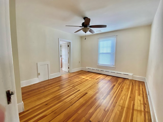 unfurnished room with baseboard heating, ceiling fan, and light hardwood / wood-style flooring