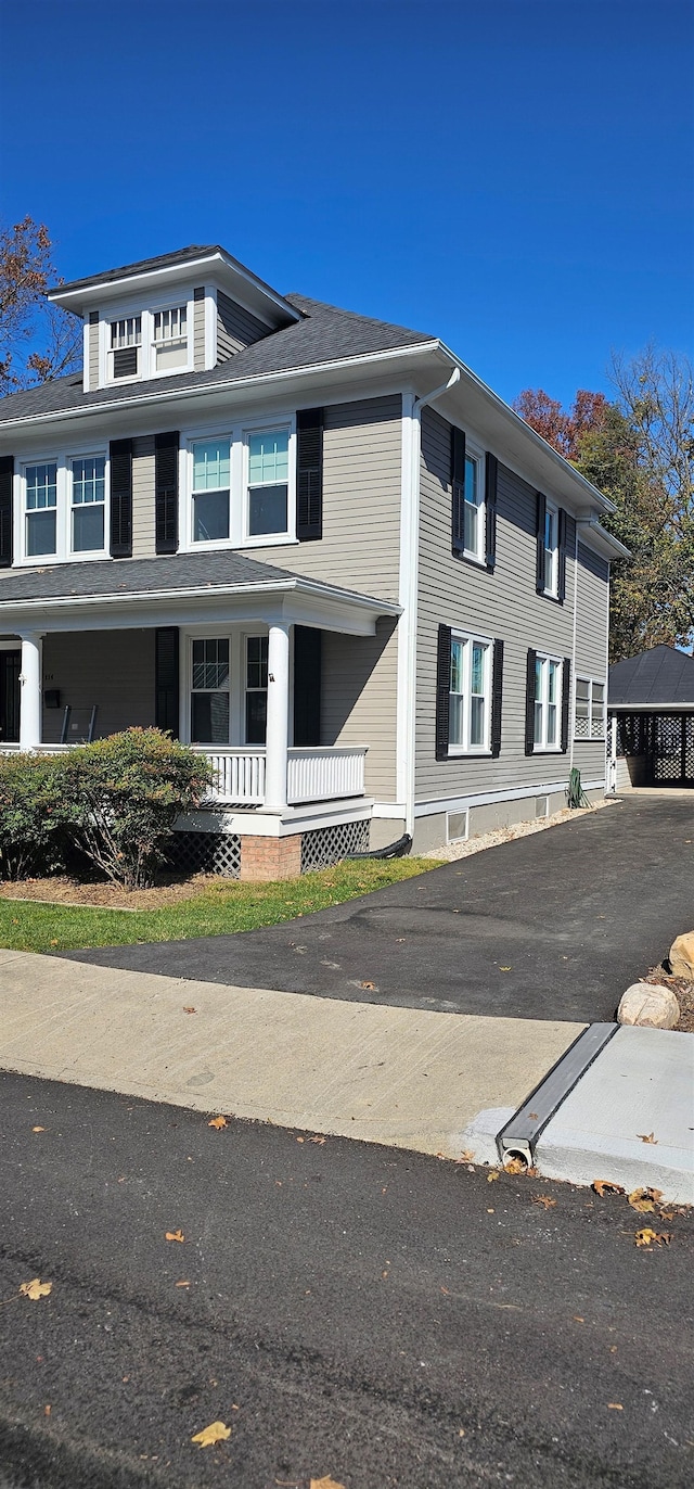 traditional style home with covered porch