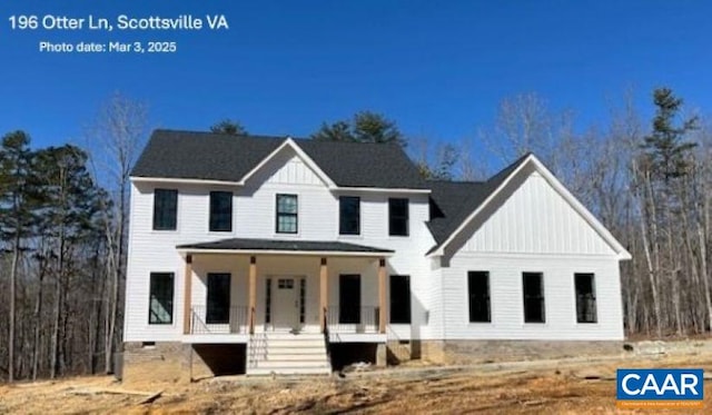 modern farmhouse featuring board and batten siding, covered porch, and crawl space