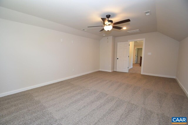 additional living space featuring ceiling fan, carpet flooring, and vaulted ceiling