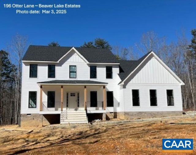 modern farmhouse style home with a porch, crawl space, and board and batten siding