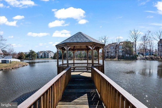 view of dock featuring a water view and a gazebo