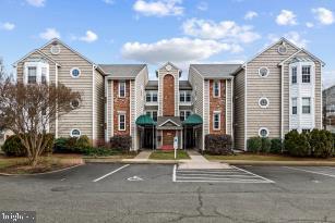 view of property with uncovered parking