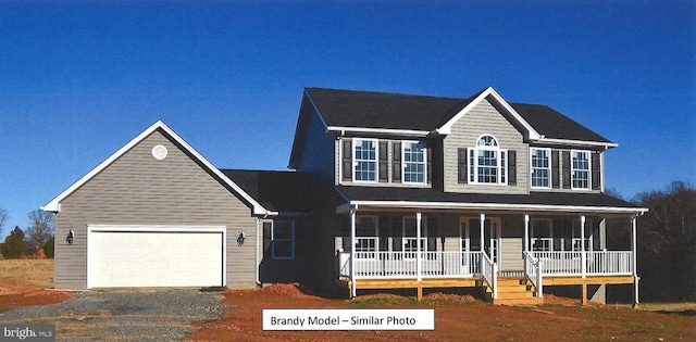 colonial house with a garage and covered porch