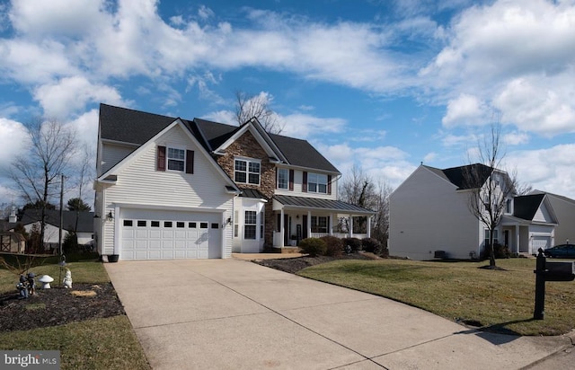 view of front facade featuring a garage, a porch, and a front yard