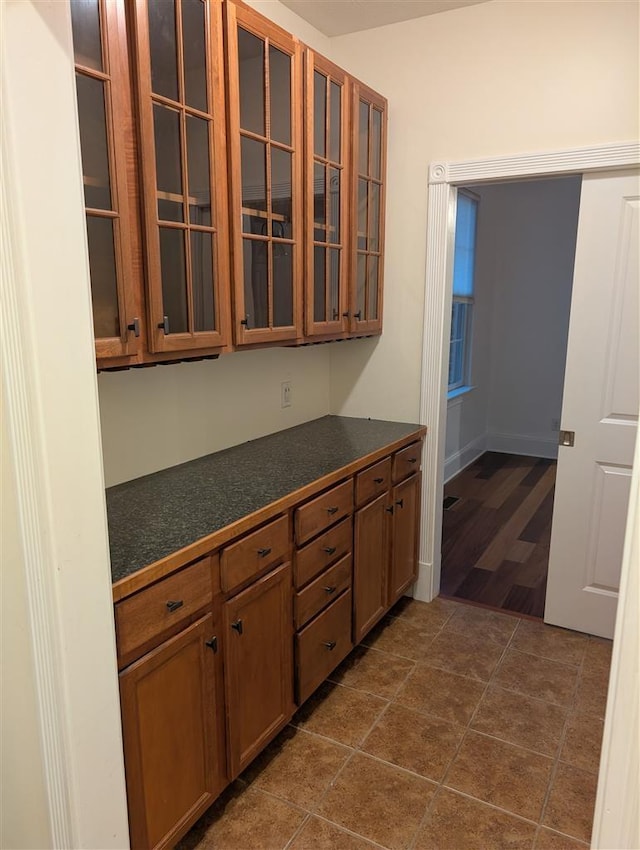 kitchen featuring dark tile patterned flooring