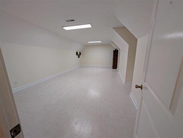 bonus room featuring vaulted ceiling