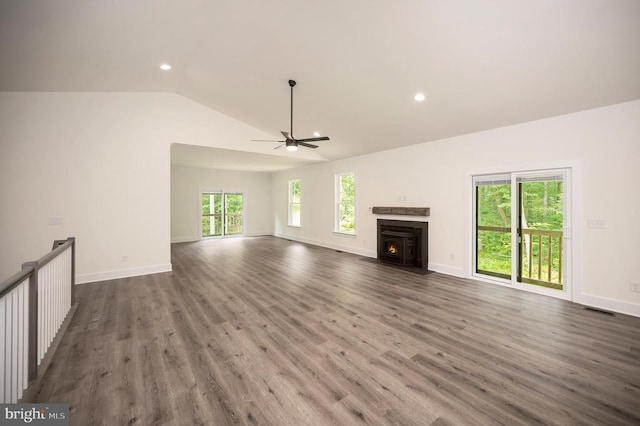 unfurnished living room with vaulted ceiling, dark hardwood / wood-style floors, and ceiling fan