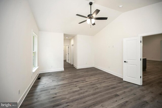 unfurnished room with high vaulted ceiling, dark wood-type flooring, and ceiling fan