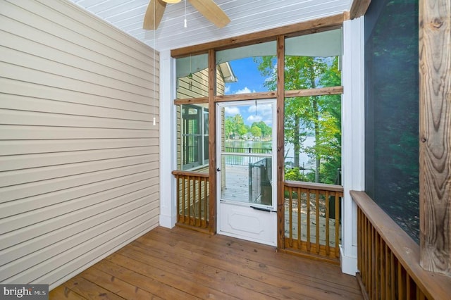 doorway featuring hardwood / wood-style flooring and ceiling fan