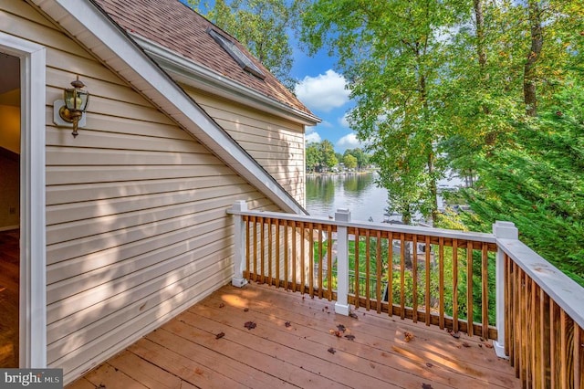 wooden terrace with a water view