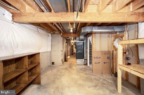 unfinished basement with heating unit