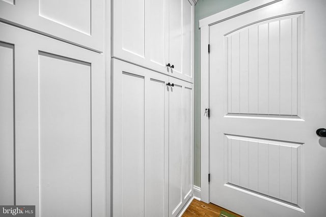 mudroom featuring dark wood-style flooring