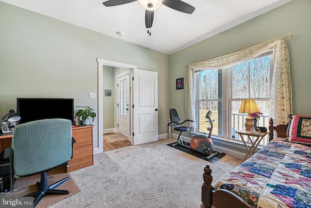 carpeted bedroom featuring baseboards and ceiling fan