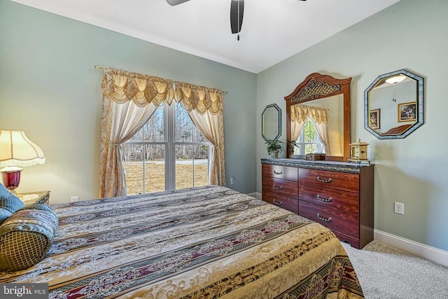 bedroom with carpet flooring, ceiling fan, and baseboards