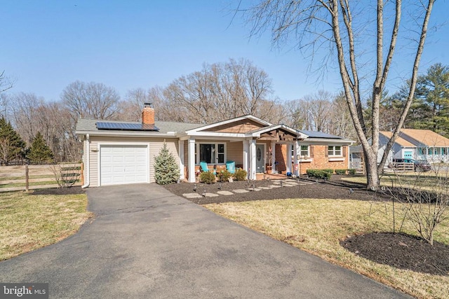 ranch-style home featuring a garage, a chimney, aphalt driveway, covered porch, and fence