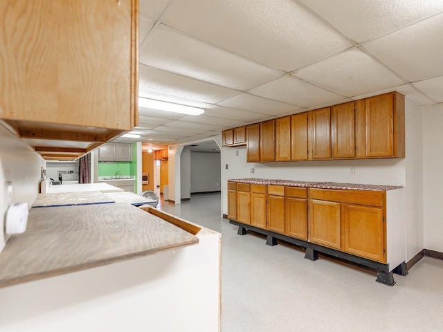 kitchen featuring a drop ceiling