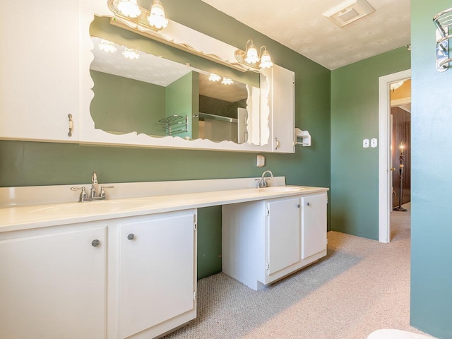 bathroom featuring vanity and a textured ceiling