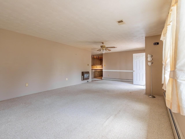 unfurnished living room featuring ceiling fan, light colored carpet, heating unit, and a baseboard heating unit