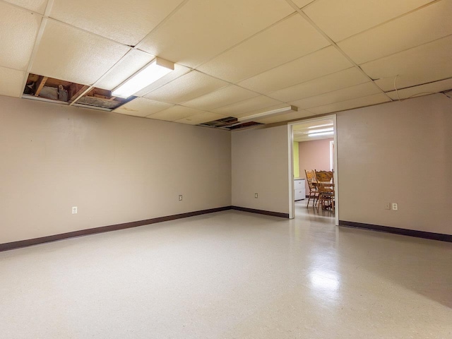 basement featuring a drop ceiling